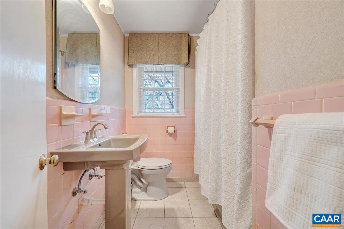 3558 Hartland Road Southwest Roanoke, VA 24015 - Photo 39 of 73 a bathroom with a sink toilet and shower
