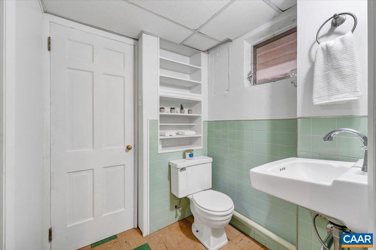 3558 Hartland Road Southwest Roanoke, VA 24015 - Photo 47 of 73 a bathroom with a sink a toilet and vanity
