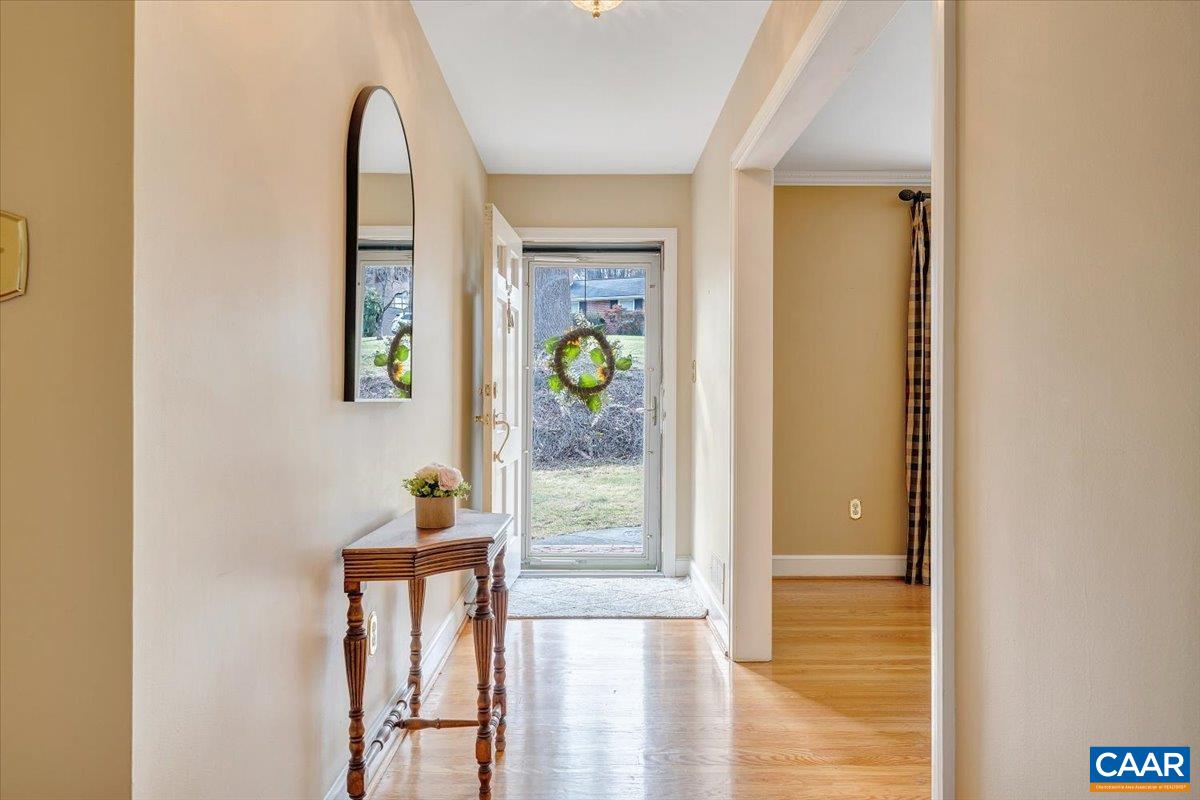 3558 Hartland Road Southwest Roanoke, VA 24015 - Photo 6 of 73 a view of an entryway with wooden floor and front door