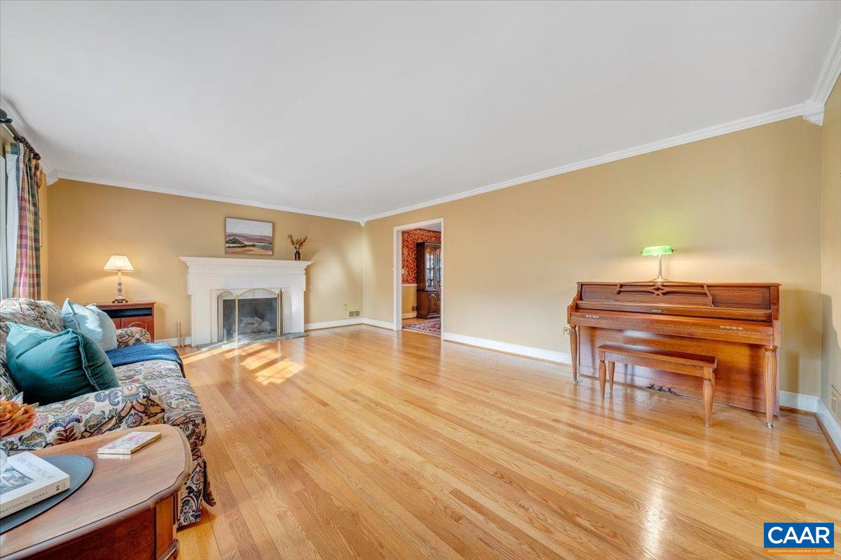 3558 Hartland Road Southwest Roanoke, VA 24015 - Photo 9 of 73 a living room with furniture a fireplace and a piano