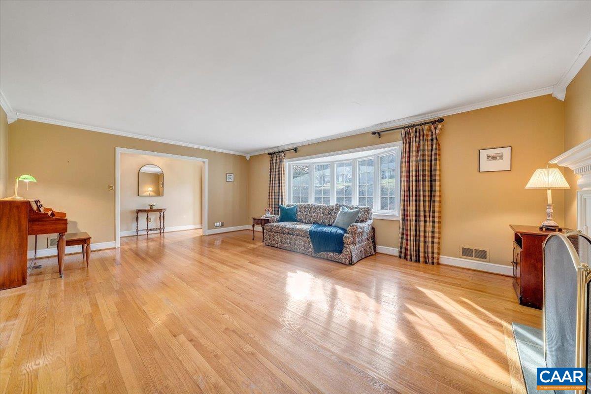 3558 Hartland Road Southwest Roanoke, VA 24015 - Photo 10 of 73 a living room with furniture window and a wooden floor