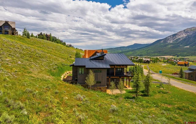 a small pool with a table and chairs under an umbrella