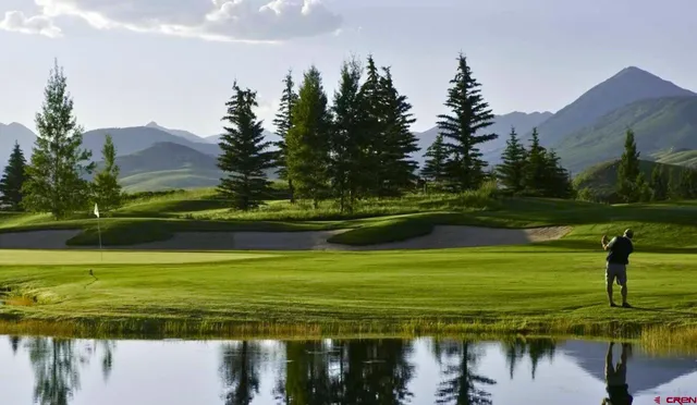 a view of a town with mountains in the background
