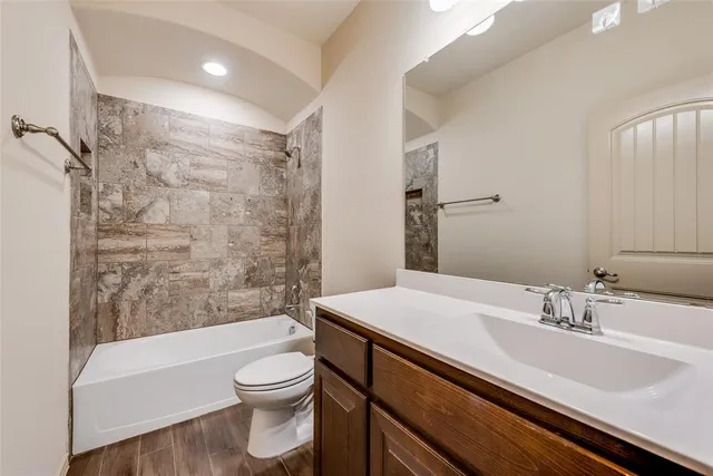 a bathroom with a sink a toilet and a bathtub