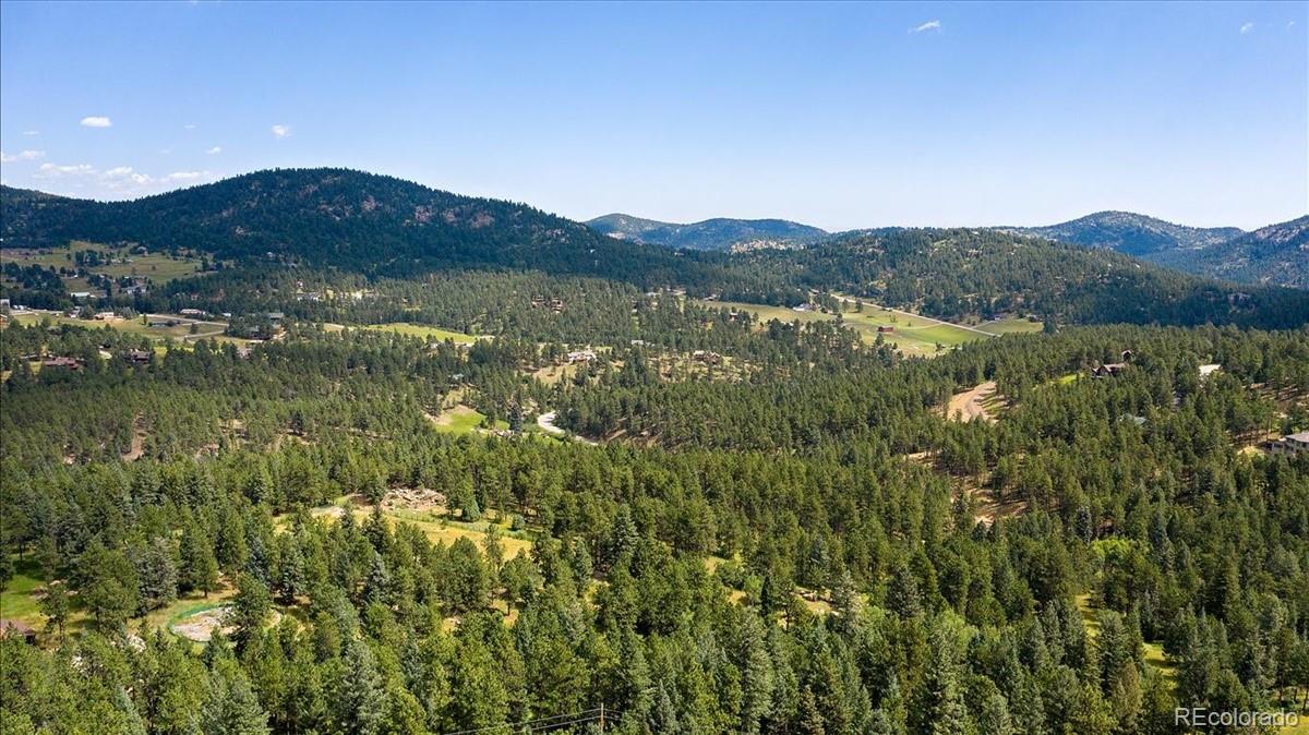 7303 Plowsher Way Morrison, CO 80465 - Photo 8 of 12 a view of lake with mountain