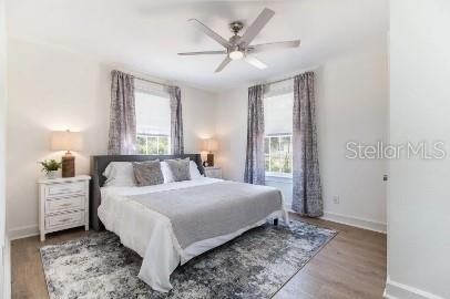 919 Southwest 6th Avenue Gainesville, FL 32601 - Photo 12 of 17 a bedroom with a large bed and a chandelier