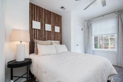 919 Southwest 6th Avenue Gainesville, FL 32601 - Photo 14 of 17 a bedroom with a bed and a window