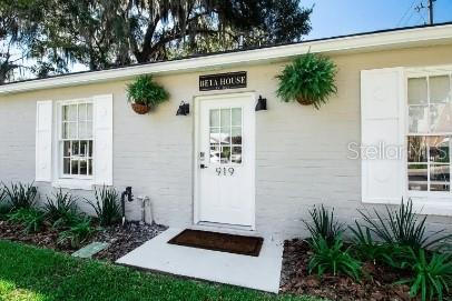 919 Southwest 6th Avenue Gainesville, FL 32601 - Photo 16 of 17 a front view of a house with a yard