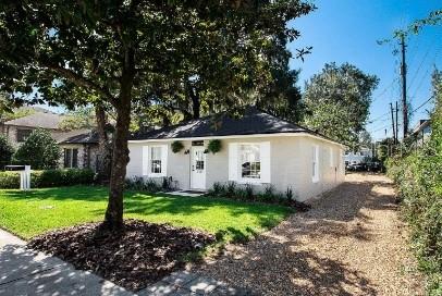 919 Southwest 6th Avenue Gainesville, FL 32601 - Photo 2 of 17 a view of a house with backyard and trees