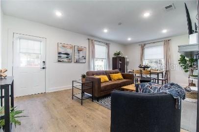 919 Southwest 6th Avenue Gainesville, FL 32601 - Photo 7 of 17 a living room with furniture and a large window