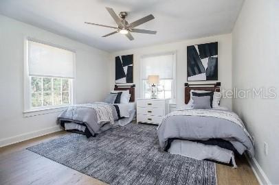 919 Southwest 6th Avenue Gainesville, FL 32601 - Photo 9 of 17 a bedroom with a large bed a rug and chair