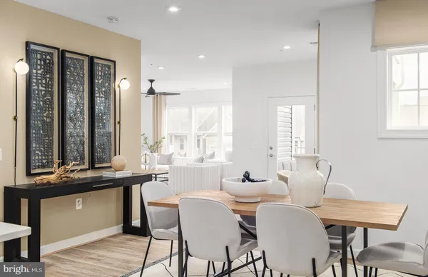 a view of a dining room with furniture and window