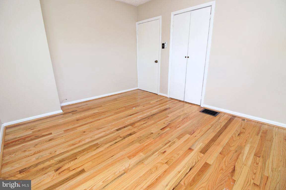 24 Hampton Road Linthicum Heights, MD 21090 - Photo 11 of 23 a view of empty room with wooden floor