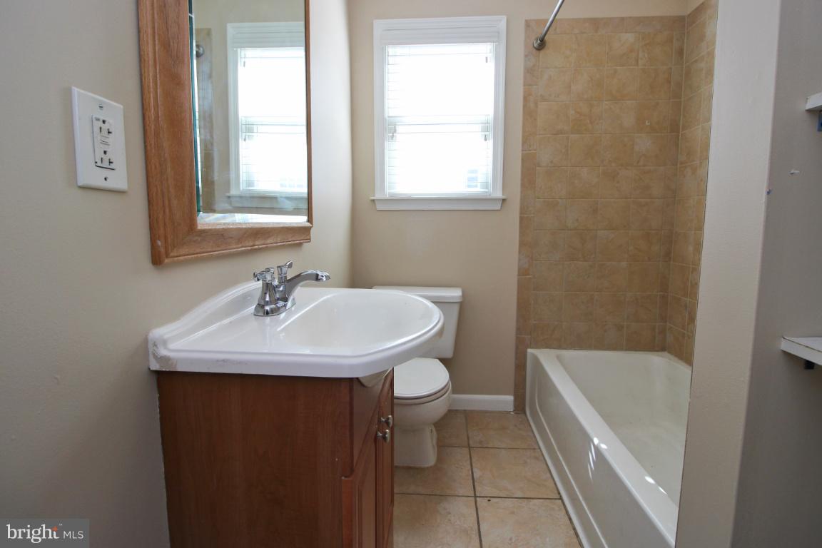 24 Hampton Road Linthicum Heights, MD 21090 - Photo 12 of 23 a bathroom with a sink a toilet and a bathtub