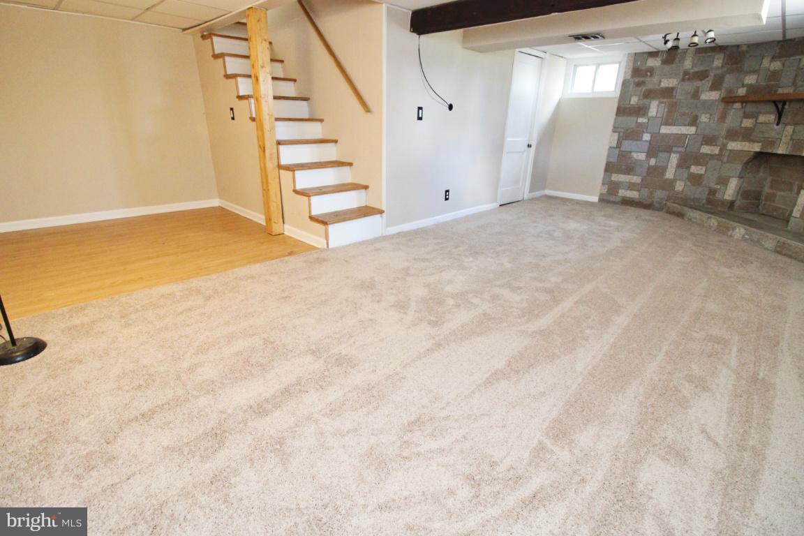 24 Hampton Road Linthicum Heights, MD 21090 - Photo 19 of 23 a view of an empty room with stairs