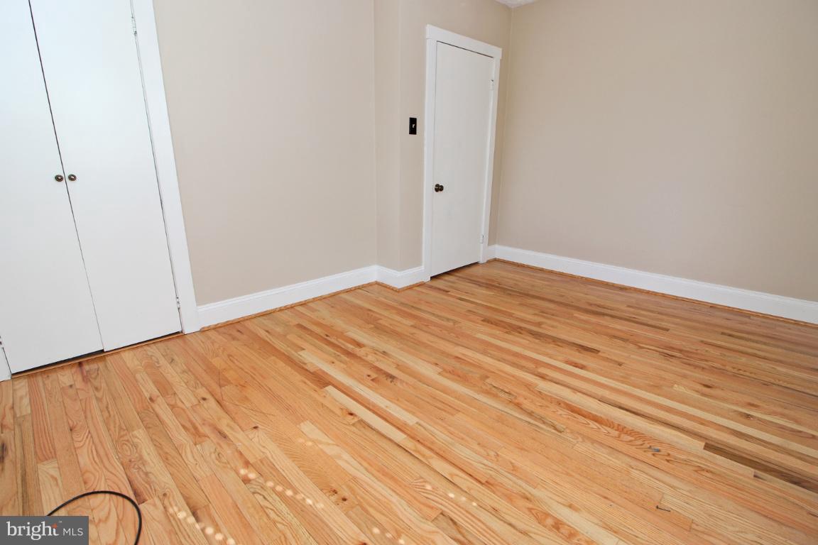 24 Hampton Road Linthicum Heights, MD 21090 - Photo 10 of 23 a view of empty room with wooden floor