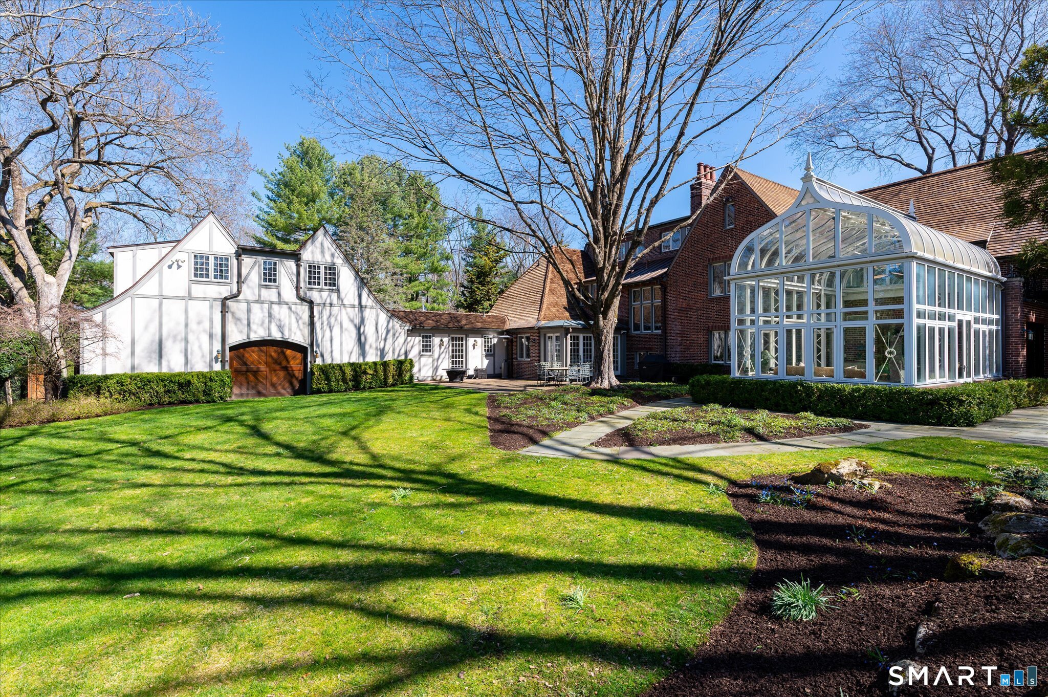 214 Good Hill Road Weston, CT 06883 - Photo 26 of 37 a view of a house with a yard