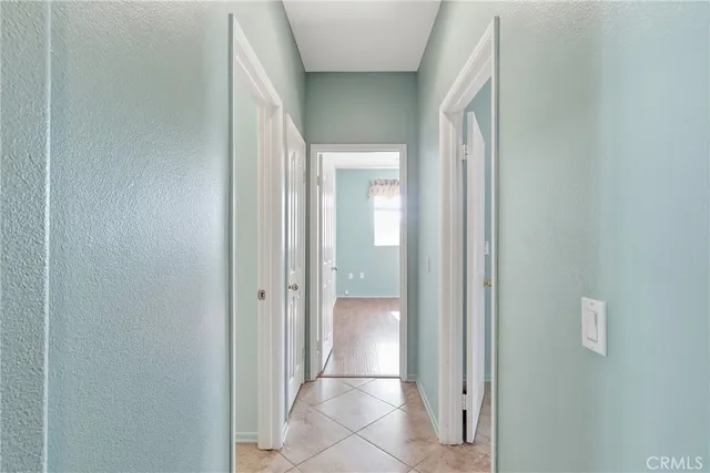 a view of a bathroom from a corridor