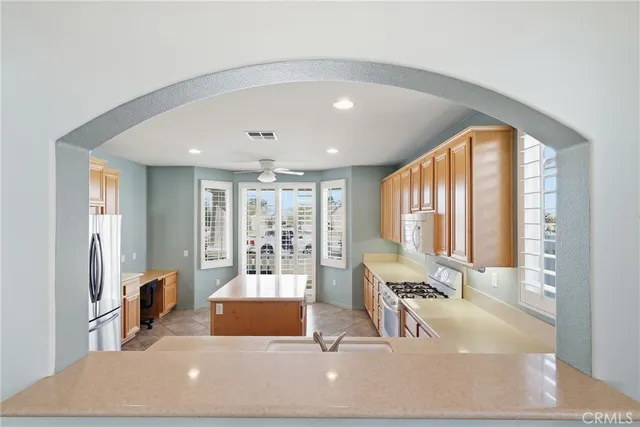 a living room with furniture and large windows