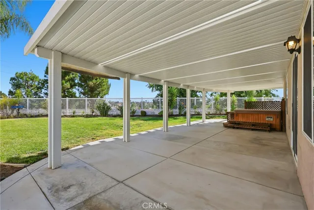 a view of a house with backyard and porch