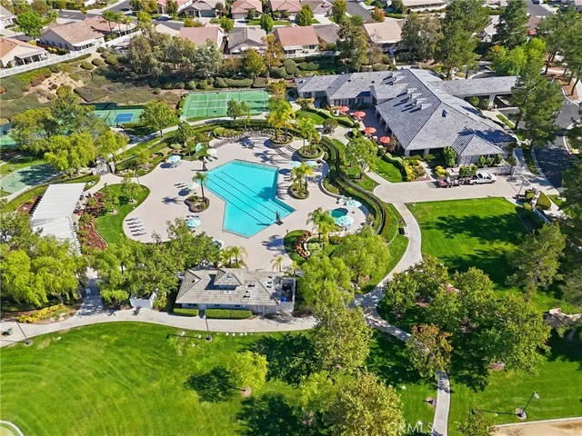 an aerial view of multiple houses with yard