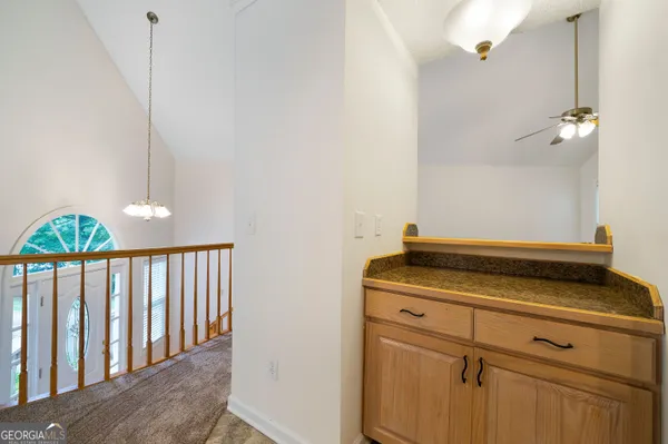 a close view of laundry room with wooden floor