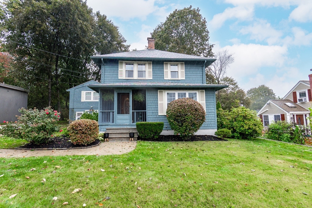 a view of a house with a yard and plants