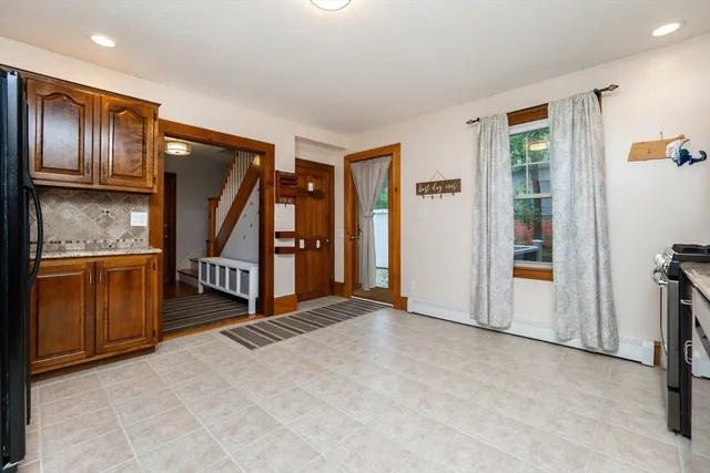 a view of an entryway with wooden floor