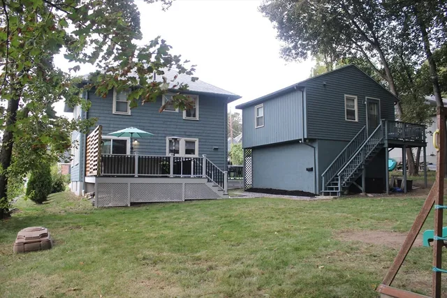 a front view of house with a garden