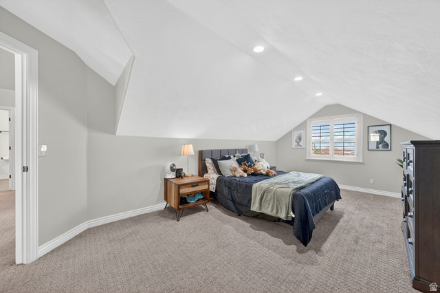 14738 Tangle Hill Road Herriman, UT 84096 - Photo 36 of 66 Carpeted bedroom featuring sloped ceilings, recessed lighting, a window with white shutters, and a white baseboard trim