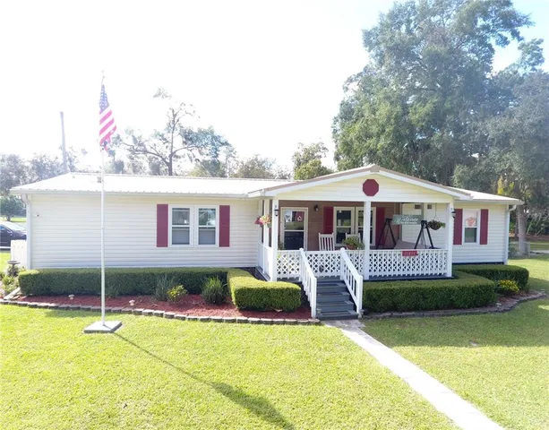 a front view of house with yard and seating area