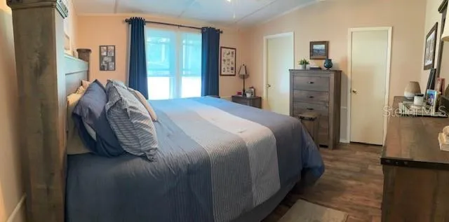 a bed sitting in a bedroom next to a window