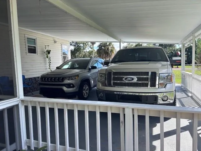 a living room with a bed furniture and a window