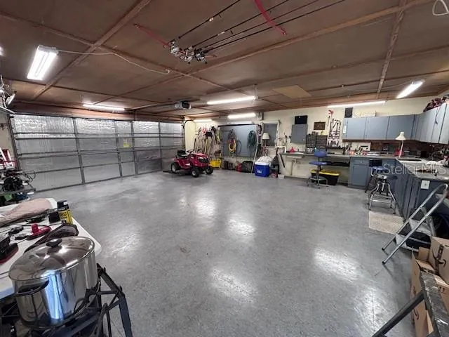 a view of a garage with a car and a garage