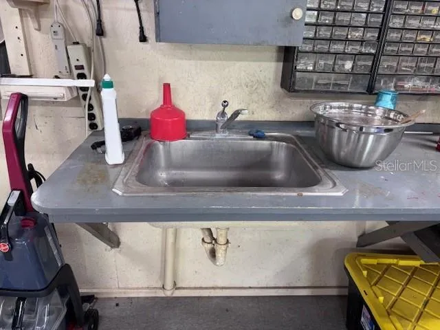 a kitchen with a sink and a stove