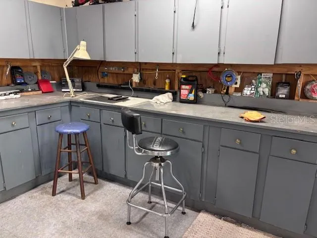 a kitchen with stainless steel appliances granite countertop a sink dishwasher and cabinets with wooden floor