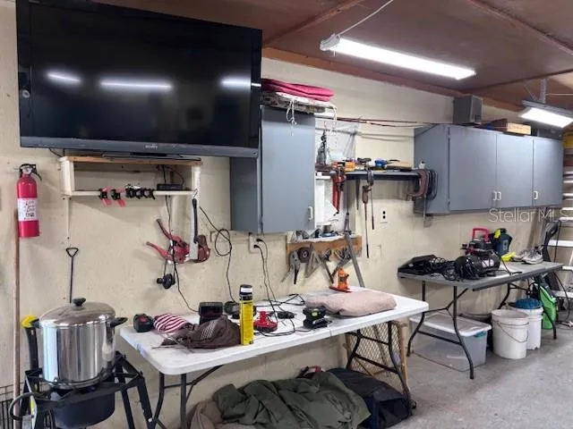 a kitchen with a table and chairs in it