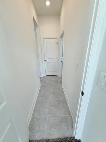 a view of hallway with white walls