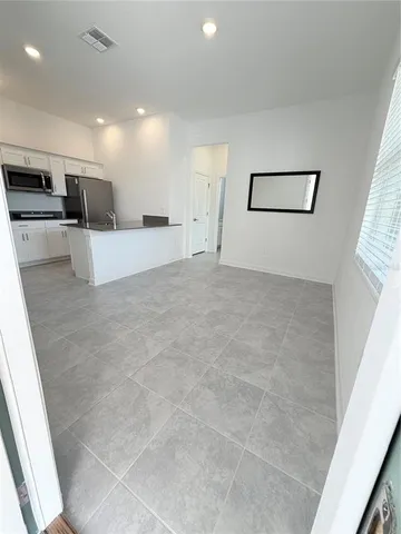 a view of kitchen with furniture and a window