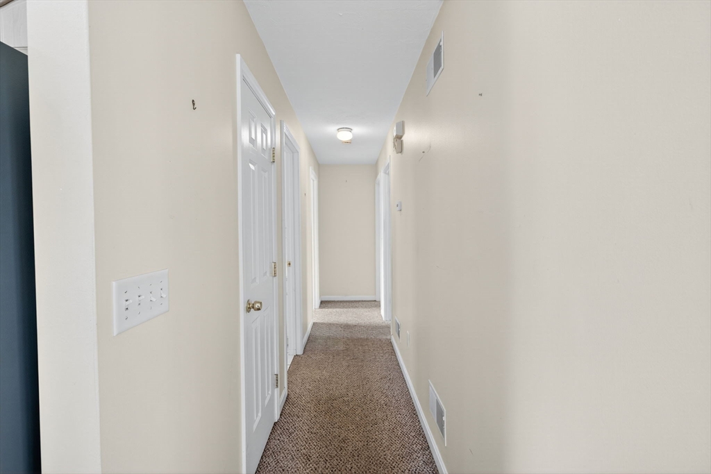 172 Stevens Street Fall River, MA 02721 - Photo 15 of 32 a view of a hallway with wooden floor