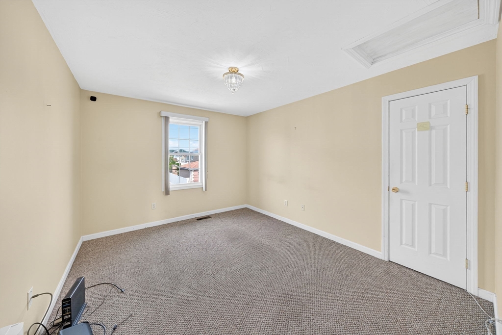 172 Stevens Street Fall River, MA 02721 - Photo 16 of 32 an empty room with windows