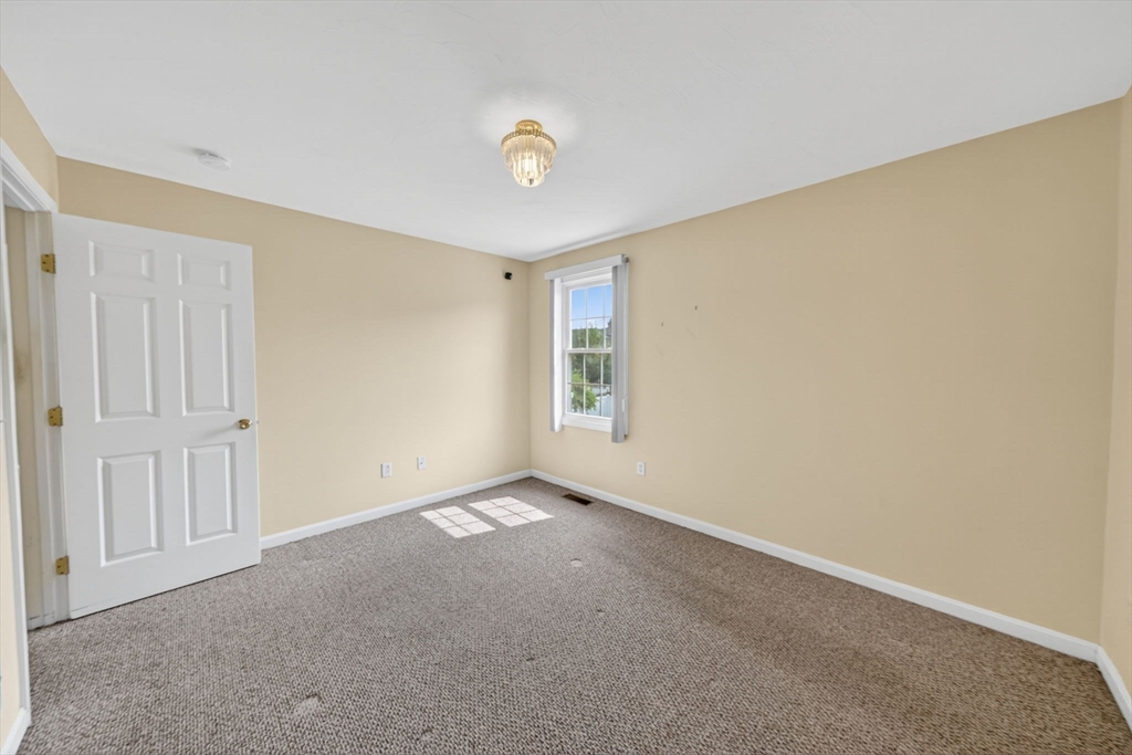 172 Stevens Street Fall River, MA 02721 - Photo 19 of 32 a view of an empty room with a window