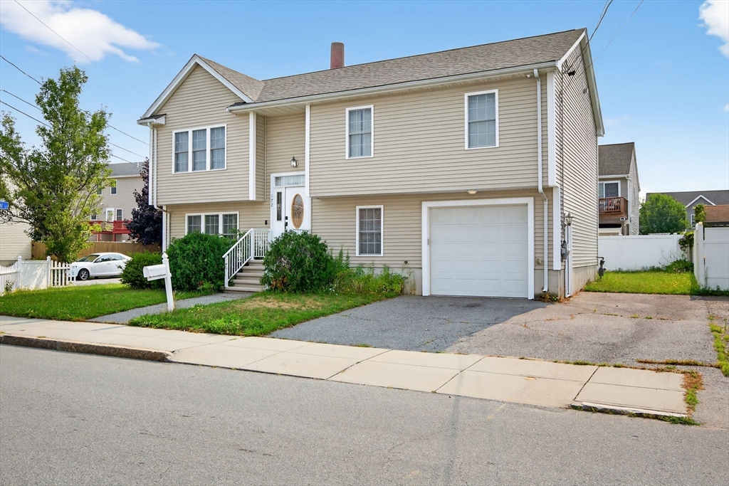 172 Stevens Street Fall River, MA 02721 - Photo 2 of 32 a view of a house with a yard and plants