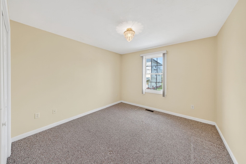 172 Stevens Street Fall River, MA 02721 - Photo 21 of 32 a view of an empty room with a window