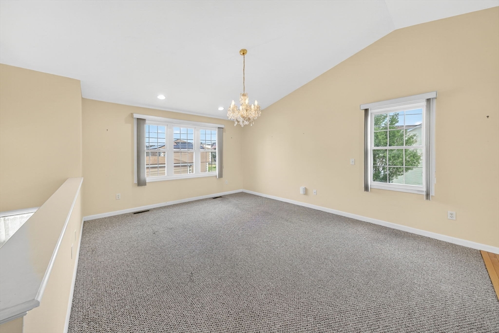 172 Stevens Street Fall River, MA 02721 - Photo 8 of 32 a view of a room with windows and ceiling fan