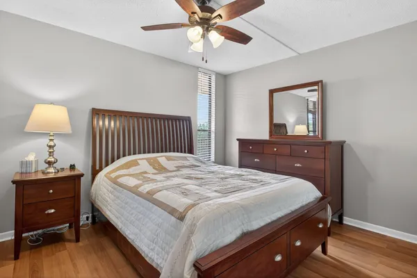 a bedroom with a bed and a dresser