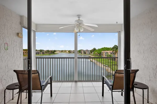 a view of a balcony with furniture