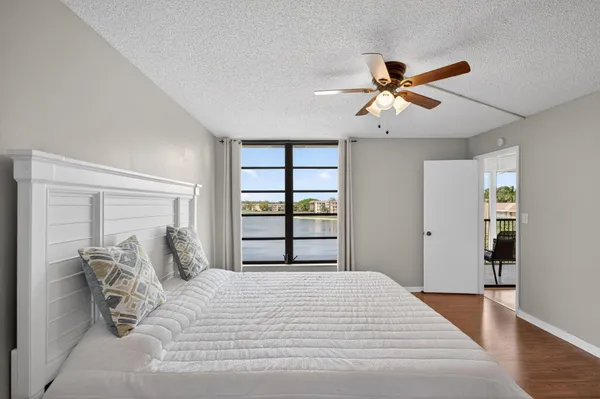 a bedroom with a large bed and a window