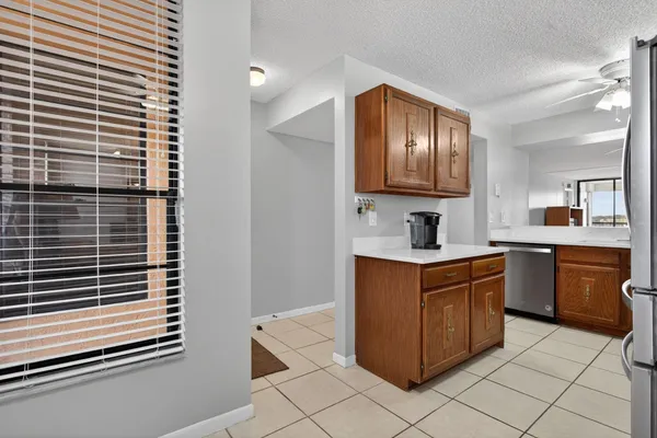 a kitchen with stainless steel appliances granite countertop a sink and cabinets
