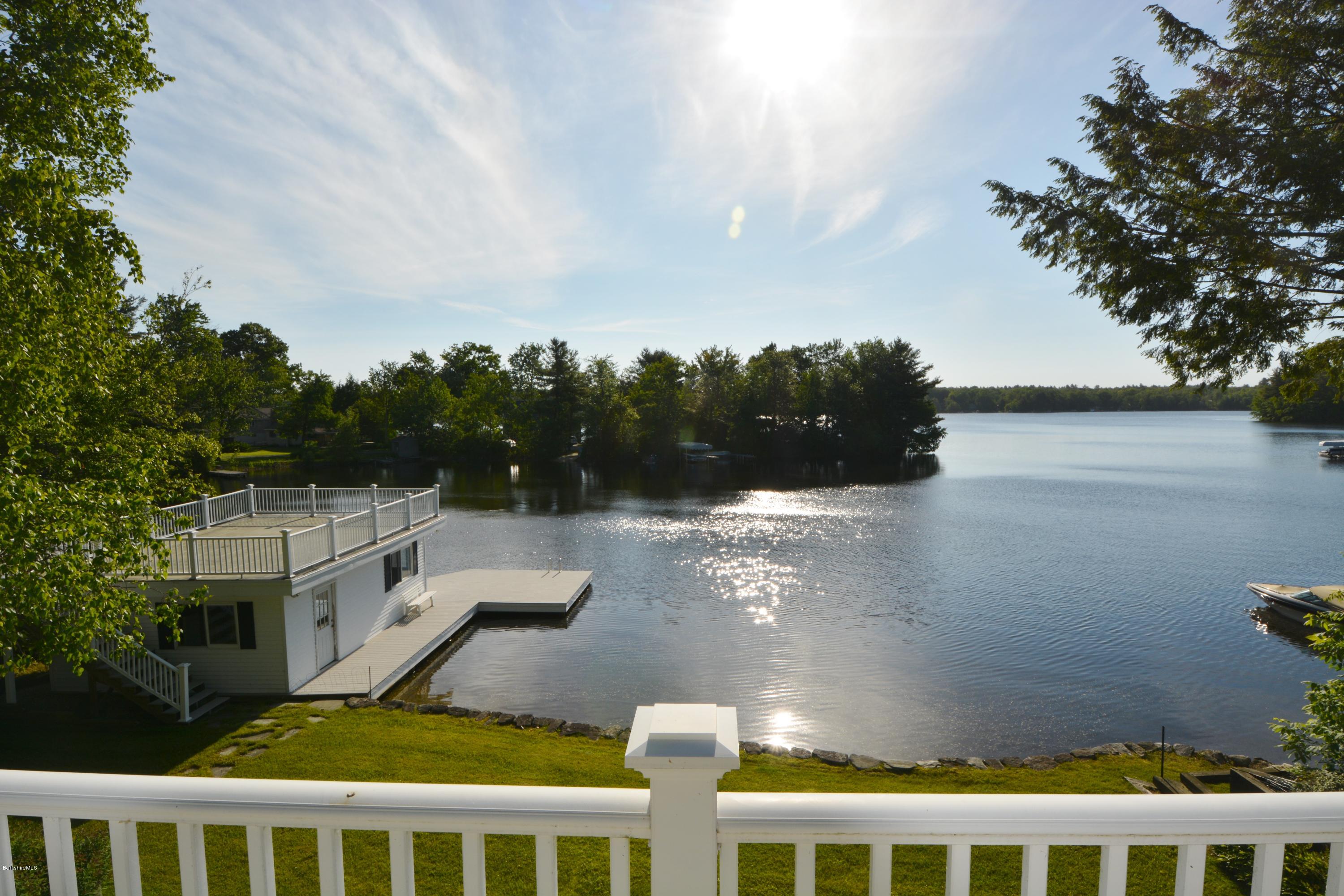 633 Pine Road Otis, MA 01029 - Photo 2 of 24 a balcony view with two plants and a lake view
